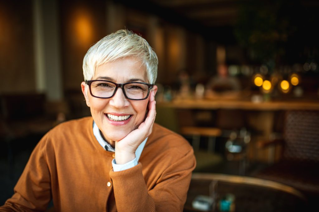 Portrait of a beautiful smiling senior woman with short hair.